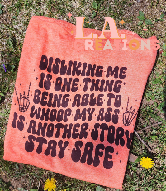 Disliking is one thing being able to whoop my ass is another story stay safe Graphic Tee